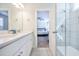 Bright bathroom featuring double sinks, white cabinets, a shower and tiled floors at 1242 Schirmer St, Mount Pleasant, SC 29464