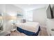 Brightly lit bedroom with carpeted floors, a side chair, and tv at 1242 Schirmer St, Mount Pleasant, SC 29464