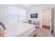 Neutral bedroom with large window, TV and carpet floors at 1242 Schirmer St, Mount Pleasant, SC 29464