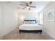 Bright bedroom with a blue bed frame, ceiling fan and neutral decor at 1242 Schirmer St, Mount Pleasant, SC 29464