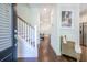 Inviting entryway with hardwood floors, staircase and neutral color palette at 1242 Schirmer St, Mount Pleasant, SC 29464