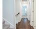 Hallway with a stairwell and view into the bedroom at 1242 Schirmer St, Mount Pleasant, SC 29464