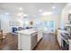 Modern kitchen with stainless steel appliances, white cabinets and a spacious center island at 1242 Schirmer St, Mount Pleasant, SC 29464