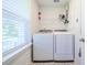 Laundry room features full-size washer and dryer and window at 1242 Schirmer St, Mount Pleasant, SC 29464