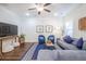 Bright living room featuring hardwood floors, a plush sofa, and a cozy seating area at 1242 Schirmer St, Mount Pleasant, SC 29464