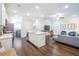 Open living space showcasing the kitchen island, hardwood floors, and stylish decor at 1242 Schirmer St, Mount Pleasant, SC 29464