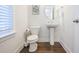 Powder room features wood floors, large mirror and toilet at 1242 Schirmer St, Mount Pleasant, SC 29464
