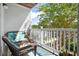 Charming outdoor balcony featuring wicker seating, a small table, and views of the surrounding greenery at 1300 Park West Blvd # 106, Mount Pleasant, SC 29466