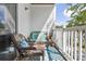 Comfortable balcony with wicker furniture, offering outdoor seating with a glimpse of trees at 1300 Park West Blvd # 106, Mount Pleasant, SC 29466