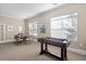 Bright game room featuring a foosball table, a table with 4 chairs, and plenty of natural light at 1300 Park West Blvd # 106, Mount Pleasant, SC 29466