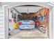 Garage interior featuring a variety of recreational gear, tools, and patriotic decor, with a car at 1300 Park West Blvd # 106, Mount Pleasant, SC 29466