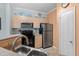 Kitchen with stainless steel refrigerator and black stove, and decorative beach themed accessories at 1300 Park West Blvd # 106, Mount Pleasant, SC 29466