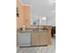 Open kitchen design with stainless steel sink and breakfast bar overlooking the living area at 1300 Park West Blvd # 106, Mount Pleasant, SC 29466