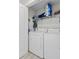 Convenient laundry room with modern washer and dryer, wire shelving, and storage space at 1300 Park West Blvd # 106, Mount Pleasant, SC 29466