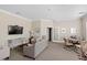 Relaxing space features a cozy seating area with a TV, a table with four chairs, and stylish decor at 1300 Park West Blvd # 106, Mount Pleasant, SC 29466