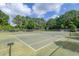 Well-maintained tennis courts surrounded by trees, offering a great recreational amenity at 1300 Park West Blvd # 106, Mount Pleasant, SC 29466