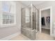 Modern bathroom featuring a glass-enclosed shower and a glimpse into a walk-in closet at 132 Clear Bend Ln, Summerville, SC 29486
