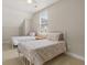 Comfortable bedroom featuring twin beds, carpet flooring, and a bright airy window at 132 Clear Bend Ln, Summerville, SC 29486