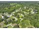 Aerial view showing the home in a lush, wooded residential neighborhood at 1337 Old Fort Rd, Moncks Corner, SC 29461