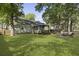 Wide backyard, featuring a fire pit, lawn, a deck with a gazebo, and mature trees at 1337 Old Fort Rd, Moncks Corner, SC 29461