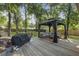 Inviting backyard deck area with gazebo, grill, and outdoor seating, perfect for entertaining at 1337 Old Fort Rd, Moncks Corner, SC 29461