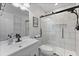 Modern bathroom featuring a glass shower, sleek black fixtures, and white marble style tile at 1337 Old Fort Rd, Moncks Corner, SC 29461