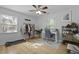 A bedroom with a light-colored hardwood floor and a ceiling fan with an overhead light at 1337 Old Fort Rd, Moncks Corner, SC 29461