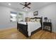 Well-lit bedroom with a bed, a window for natural light, and a dark wood bed frame at 1337 Old Fort Rd, Moncks Corner, SC 29461