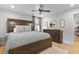 Cozy bedroom featuring a stylish ceiling fan, wooden bed frame, and decorative wall art at 1337 Old Fort Rd, Moncks Corner, SC 29461