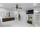 Bright bedroom featuring white walls, ensuite bathroom, and ample closet space with modern furnishings at 1337 Old Fort Rd, Moncks Corner, SC 29461