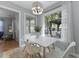 Bright dining area featuring natural light, modern table and seating, with view to an outdoor lounge at 1337 Old Fort Rd, Moncks Corner, SC 29461