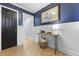 Inviting entryway boasting wainscoting, hardwood floors, and stylish decor at 1337 Old Fort Rd, Moncks Corner, SC 29461