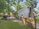 View of backyard with deck, gazebo, well-maintained lawn and a wooden fence at 1337 Old Fort Rd, Moncks Corner, SC 29461