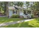 Lovely home with a welcoming front porch, brick chimney, green lawn, and a sidewalk leading to the entrance at 1337 Old Fort Rd, Moncks Corner, SC 29461