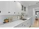 Bright kitchen features white cabinets, stylish black faucet, marble countertops, and modern decor at 1337 Old Fort Rd, Moncks Corner, SC 29461
