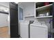 Functional laundry room with washer, dryer, storage cabinets, and a folding door at 1337 Old Fort Rd, Moncks Corner, SC 29461