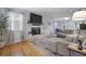 Bright and airy living room with a fireplace, plush seating, and hardwood floors at 1337 Old Fort Rd, Moncks Corner, SC 29461