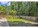 Spacious backyard with a garden area and privacy fence, providing a serene outdoor space at 1350 Water Edge Dr, Charleston, SC 29492