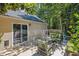 Backyard patio area with comfortable outdoor seating, lush greenery and exterior house view at 1350 Water Edge Dr, Charleston, SC 29492