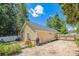The backyard features an outdoor storage building with pea gravel, gardening area and wood fence at 1350 Water Edge Dr, Charleston, SC 29492