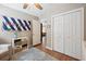 Bright bedroom with a ceiling fan, area rug, closet, and a flag on the wall at 1350 Water Edge Dr, Charleston, SC 29492