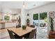 Open dining area with table, leads to a modern kitchen and outdoor patio with seating at 1350 Water Edge Dr, Charleston, SC 29492