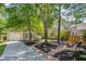 Charming home with a firepit area, garden beds and attached garage at 1350 Water Edge Dr, Charleston, SC 29492