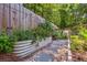 Charming garden featuring a raised garden bed with stepping stones and lush greenery at 1350 Water Edge Dr, Charleston, SC 29492