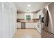 Well-lit kitchen with white cabinets, stainless steel appliances, and wood countertops at 1350 Water Edge Dr, Charleston, SC 29492