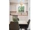 Bright, modern kitchen features a view of the yard, tile backsplash and wood countertops at 1350 Water Edge Dr, Charleston, SC 29492
