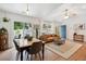 Inviting living room and dining area with a bright interior and access to an outdoor patio at 1350 Water Edge Dr, Charleston, SC 29492