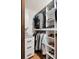 Well-organized walk-in closet with custom shelving, drawers, and ample storage space at 1350 Water Edge Dr, Charleston, SC 29492