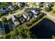 Captivating aerial view of a house on a large lot, bordered by a serene pond at 136 Heart Pine Cir, Summerville, SC 29485