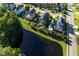 Beautiful aerial view of a house in a community next to a tranquil pond at 136 Heart Pine Cir, Summerville, SC 29485